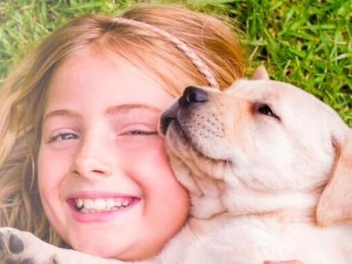 girl and puppy